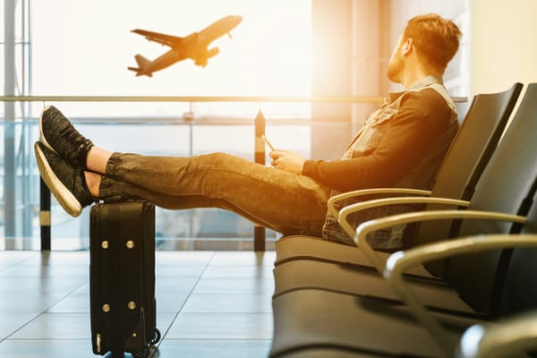 A man chilling while waiting for his flight
